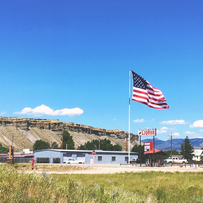 American flag over liquor store 